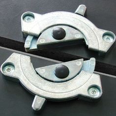 two metal latches on the side of a vehicle