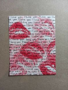 a piece of paper with writing on it and red lipstick painted on the inside of it