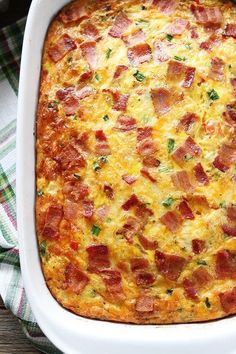 a casserole with ham and cheese in a white dish on a plaid cloth