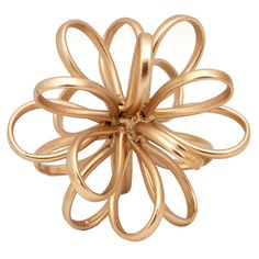 a gold ring that is shaped like a flower