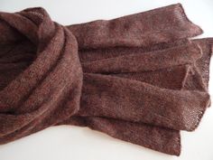 Knitted alpaca scarf of cherry-brown colour with melange effect. The yarn I used is mix of alpaca, merino wool, viscose  and polyamide, scarf is not thick and very soft. This knitted scarf is a perfect accessory for autumn, you can throw it over your shoulders or wrap it around your neck. It also can be a great gift for any occasion. Ready to ship. Measurements: 185 cm / 72.83" - long 55 cm / 21.65" - width Yarn (Italy) - alpaca, merino wool, viscose, polyamide  Made in a smoke free environment. Brown Alpaca Shawl For Fall, Brown Knitted Shawl For Fall, Brown Alpaca Shawl, Brown Wool Shawl Scarf, Brown Winter Shawl Wrap, Brown Scarf Wrap For Fall, Brown Fall Scarf Wrap, Elegant Brown Cashmere Shawl, Alpaca Brown Shawl For Winter