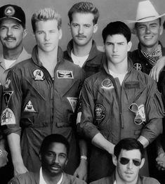 an old black and white photo of men in pilots uniforms posing for a group photo