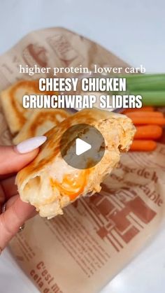 a person holding some food in their hand with the words cheesy chicken crunchwrap sliders