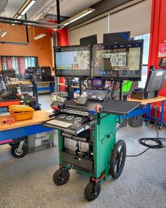 an office with multiple computers and other equipment