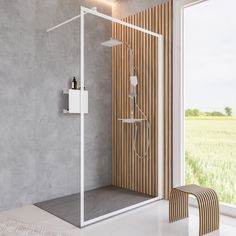 a bathroom with a walk in shower next to a sliding glass door that leads out onto a green field