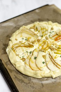 an uncooked pizza sitting on top of a pan