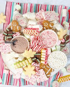 a platter filled with lots of different types of cookies and candies on top of a table