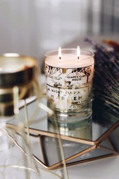 a candle sitting on top of a glass table