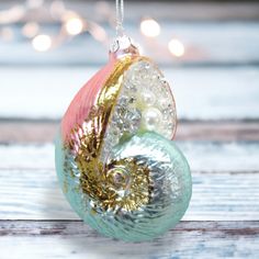 Metallic Nautilus Shell - December Diamonds Holiday Ornament - Mellow Monkey Sea Shell Themed Christmas Tree Ornaments, Beach Theme Xmas Ornaments, Sea Ornaments, Christmas Starfish Ornaments, Ocean Christmas Ornaments, Ocean Ornaments, Painted Resin, Holiday Toys, Nautilus Shell