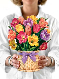 a woman holding a basket filled with colorful flowers