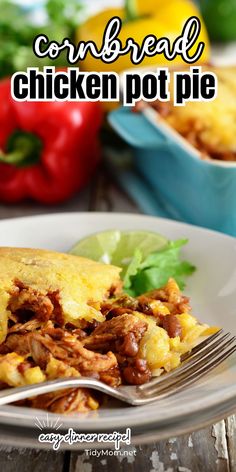 a close up of a plate of food with a fork on it and the words cornbread chicken pot pie