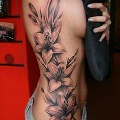 a woman's stomach with flowers on it