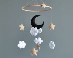 a mobile with stars and clouds hanging from it