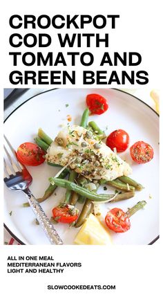 a white plate topped with green beans and tomatoes