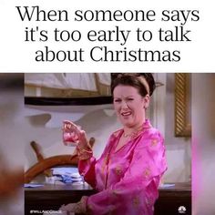 an image of a woman in pink holding up a christmas ornament that says, when someone says it's too early to talk about christmas