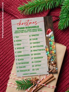 a christmas word scramble is on top of a brown envelope with candy canes and cinnamon sticks