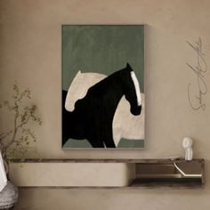 a black and white horse painting on a wall above a shelf with a plant in it