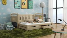 a child's bedroom with blue walls and green carpeted flooring, including a wooden daybed