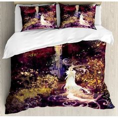 a bed covered in a purple and white comforter with an image of a woman