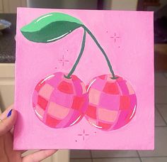 a painting of two cherries on a pink background