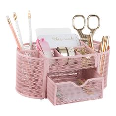 a pink desk organizer with pens, pencils and other office supplies