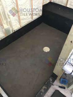 the inside of a room with concrete flooring and walls being built into it's wall