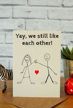 a card that says yay, we still like each other with a zebra next to it