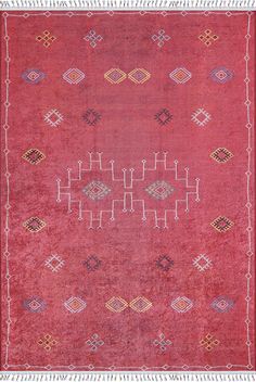 an old red rug with various geometric designs