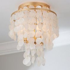 a chandelier hanging from the ceiling in a room