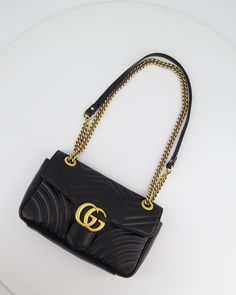 Gucci Black Small GG Marmont Shoulder Bag in Matelassé Chevron Leather This bag is in very good condition, with light general signs of wear to the leather and hardware. Please note that there is moderate wear to the interior of the bag. Please see the photos for more information on this item Brand - Gucci Model - Marmont Shoulder Bag Hardware - Gold Measurements – 25cm x 15cm x 7.5cm STrap length - 55cm Accompanied by the Original dust bag and Entrupy Certificate Code - D022709344 Ref - 031224 We are not affiliated with the brands we sell Please note that all of our items are and sold on behalf of private individual sellers. Purchasing through us is contributing to an ethical and sustainable fashion future. All our items come with an. All sales are final. All international purchases are se Bag Hardware, Fashion Future, Bags For Sale, Gucci Marmont, Gucci Model, Gucci Models, Fendi Shoes, Gg Marmont, Louis Vuitton Shoes