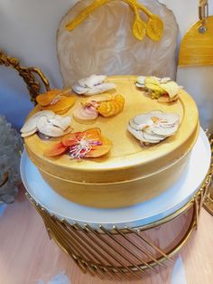 a round wooden table topped with lots of different types of food on top of it