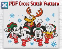 mickey mouse and friends cross stitch pattern on a white brick wall with snowflakes