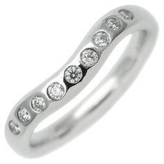 TIFFANY & Co. Elsa Peretti Platinum Diamond 3mm Curved Band Ring 4.5 Metal: Platinum Size: 4.5 Weight: 5.0 grams Width: 3mm Diamond: Nine round brilliant diamonds, carat total weight .10 Hallmarked: ©PERETTI SPAIN TIFFANY&CO. PT950 Condition: Excellent condition Tiffany Retail Price: $2,500 Authenticity guaranteed Nine Diamond Ring, Wedding Jewelry Tiffany, Tiffany Wedding Band Tiffany & Co., Elsa Peretti Jewelry Rings, Modern Wedding Rings, Open Heart Ring, Starfish Earrings, Elsa Peretti, Curved Wedding Band