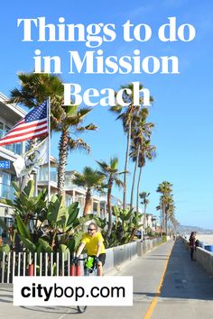 a man riding a bike down a street next to palm trees and the words things to do in mission beach