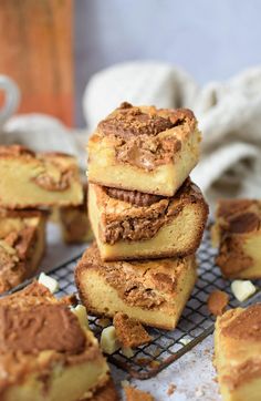 several pieces of cake sitting on top of a cooling rack