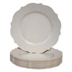 white dinner plates stacked on top of each other in front of a white background,