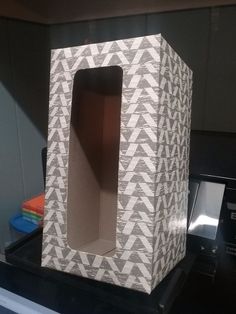 a cardboard box sitting on top of a counter