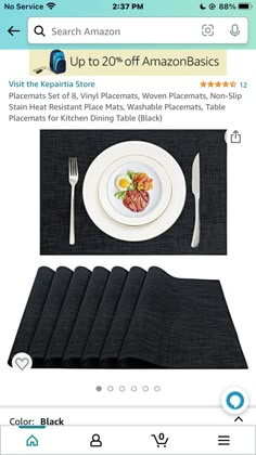 a table setting with place mats, forks and knifes on top of each plate