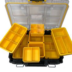 an open yellow and black case filled with lots of different sized trays on top of each other