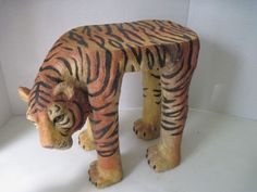 a ceramic tiger figurine standing on its hind legs