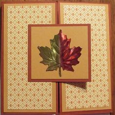 two folded cards with a leaf on one side and an orange, yellow, and red maple leaf on the other