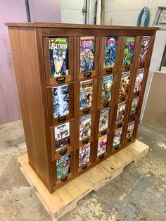 a wooden cabinet with many comics on it