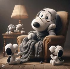 a cartoon character sitting in a chair next to two stuffed dogs and a lamp on a table