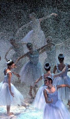 several ballerinas are dancing in the snow