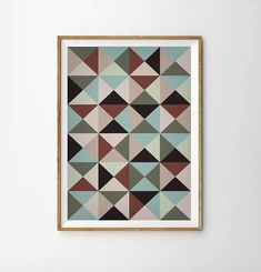 a framed art print with an abstract geometric design in blue, green and beige colors