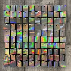 an array of holographics on a wooden surface