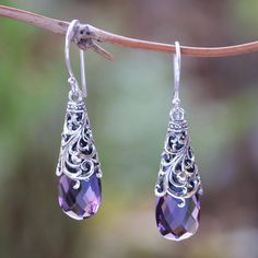 Capturing the beauty of a princess these dangle earrings are designed by Made Sugi in Bali. She selects two faceted amethyst gemstones totaling six carats. Each gem is caressed by swirling openwork patterns in sterling silver. Princess Beauty, Princess Jewelry, Silver Link Bracelet, Stylish Earrings, Dragon Necklace, Amethyst Jewelry, Earring Crafts, Pearl Earrings Dangle, Amethyst Earrings