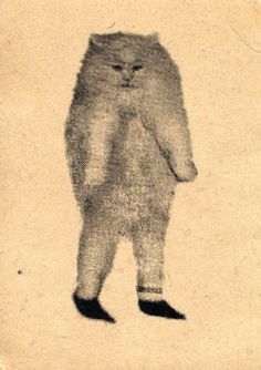 an old photo of a cat standing on its hind legs