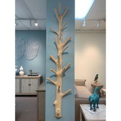 a wooden sculpture of a tree on the wall