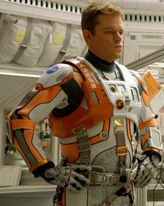 a man in an orange and white space suit